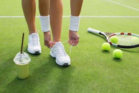 Tennis player preparing before the gameの写真素材