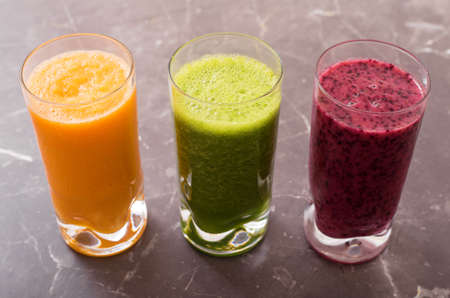 Three different smoothies in glassesの写真素材