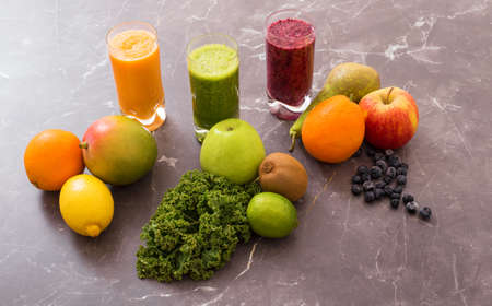 Three different smoothies with ingredientsの写真素材