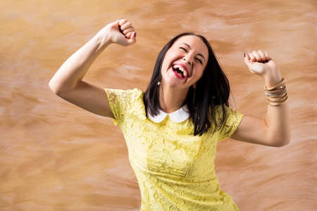 Woman celebrating her successの写真素材