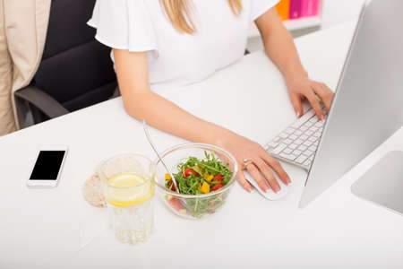 woman in the office with healthy lunchの写真素材