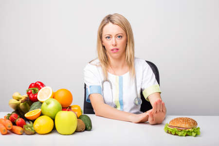Health professional promoting to eat  healthyの写真素材