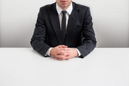 Business man siting by the desk