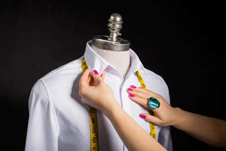 Woman fixing the manekenの写真素材
