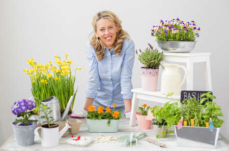 Happy gardener growing greens and flowersの写真素材