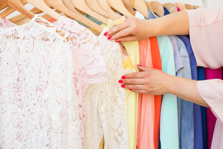 Woman looking at the clothing rackの写真素材