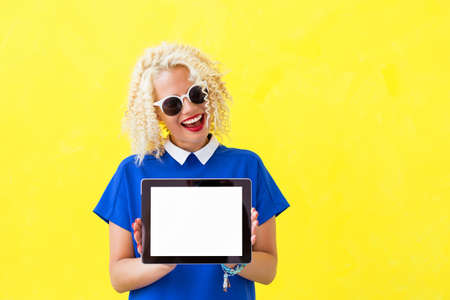 Woman holding blank screen tabletの写真素材