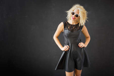 Happy woman with hands on her hipsの写真素材