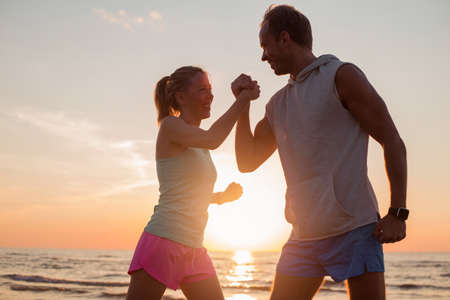 Couple shaking hands workoutの写真素材