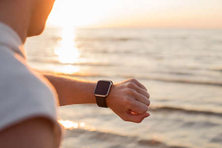 Man looking at smartwatchの写真素材