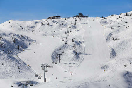 Ski slopes and lifts in skiing resortの写真素材