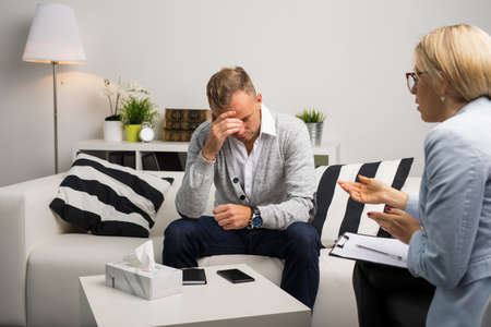 Man visiting doctors office for therapyの写真素材
