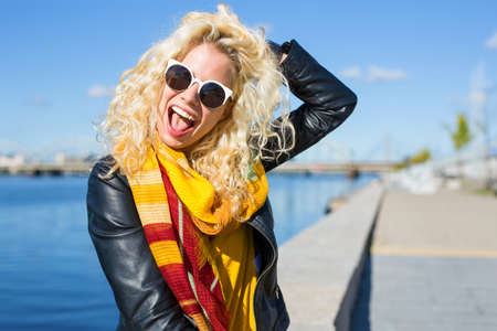 Funny and happy woman enjoying the weatherの写真素材