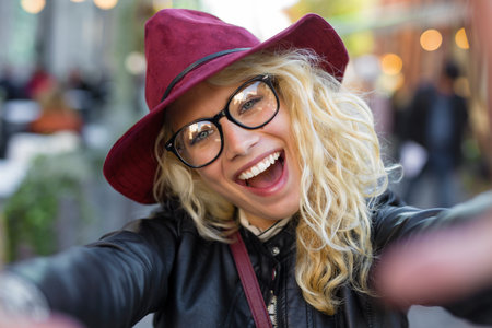 Funny hipster woman taking selfie