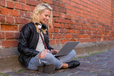 Woman working on her laptopの写真素材