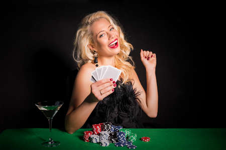 Lucky woman playing pokerの写真素材