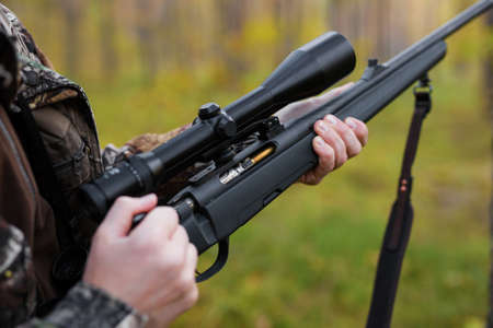 Hunter loading his gunの写真素材