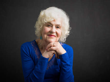 Happy and beautiful portrait of elderly womanの写真素材