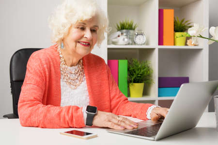 Senior working at the officeの写真素材