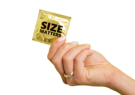 Woman holding a condom