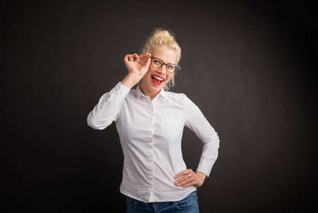 Woman showing off her new glassesの写真素材