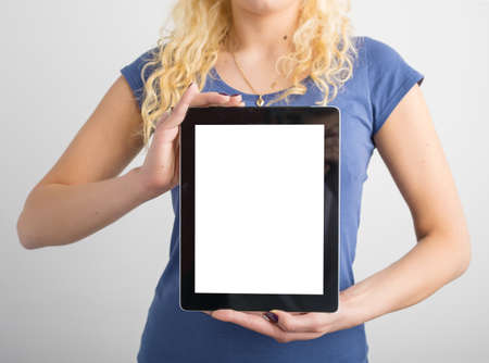 Person holding vertical blank screen tabletの写真素材