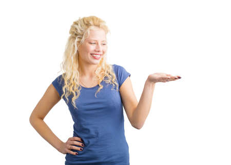 Woman looking at her extended handの写真素材