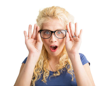 Woman with new optical glasses on showing her surpriseの写真素材