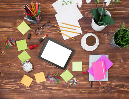Creative office supplies and tablet on wooden backgroundの写真素材