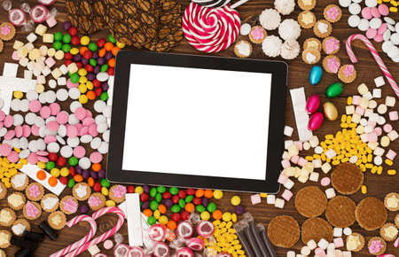 Tablet computer and candyの写真素材