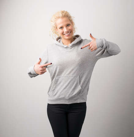 Woman in gray hoodie, mockup for logo or branding designの写真素材