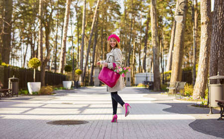 Parisian woman walking in parkの写真素材