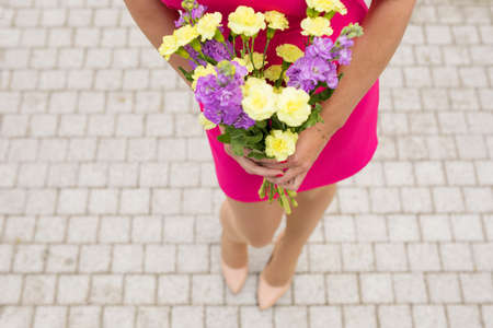 Girl holding flowersの写真素材