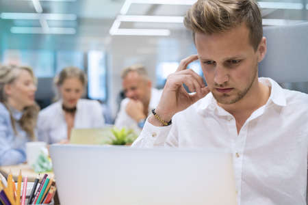 Man working on computer in officeの写真素材