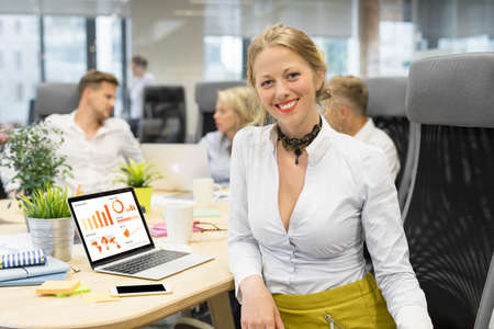 Woman in meeting working on chartの写真素材