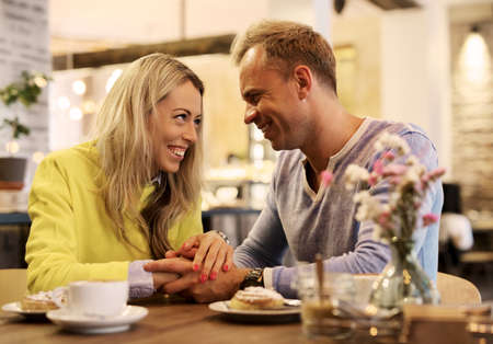 Lovely couple in cafeの写真素材