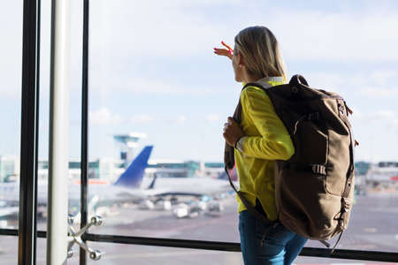 Young girl in airport ready for new adventuresの写真素材