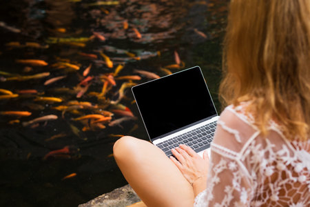 Woman working with laptop computer zen likeの写真素材