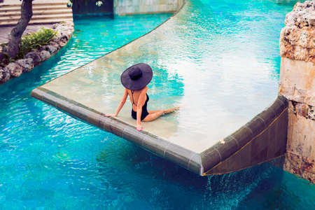 Woman relaxing in poolの写真素材