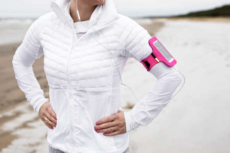 Runner on the beach in winterの写真素材