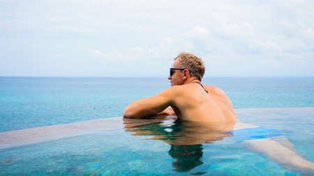 Man in infinity poolの写真素材