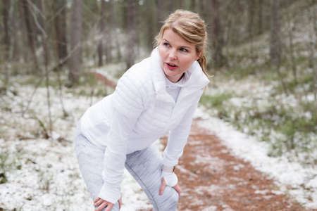 Woman during training outdoors in winterの写真素材