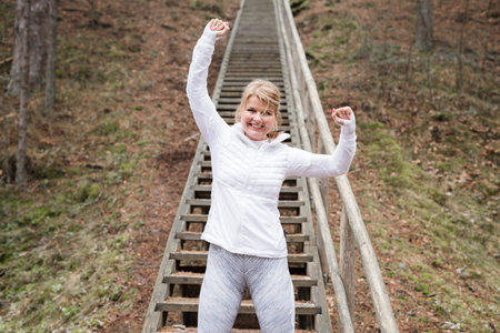 Excited woman after workout outdoors