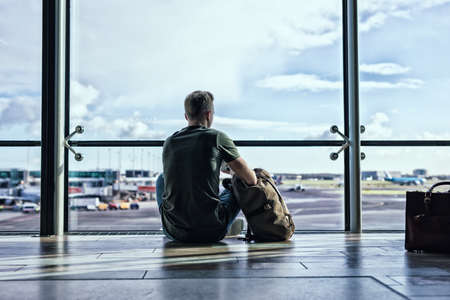 Man sitting in airportの写真素材