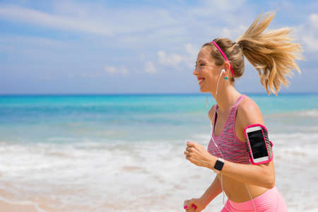 Woman run on the beachの写真素材