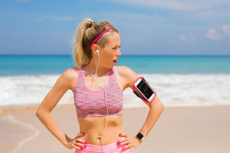 Fitness woman on the beachの写真素材