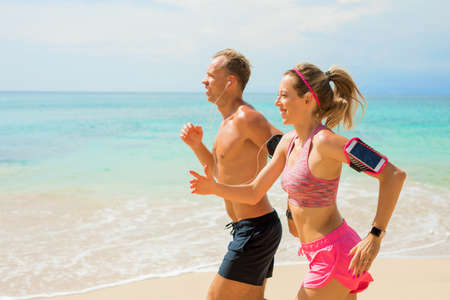 Couple run on the beachの写真素材
