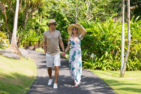 Couple walking on vacation in tropical resortの写真素材
