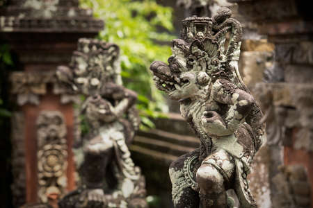 Traditional ancient sculptures of temple in Bali, Indonesiaの写真素材