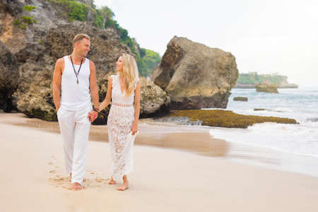 Couple enjoying honeymoon on tropical beachの写真素材